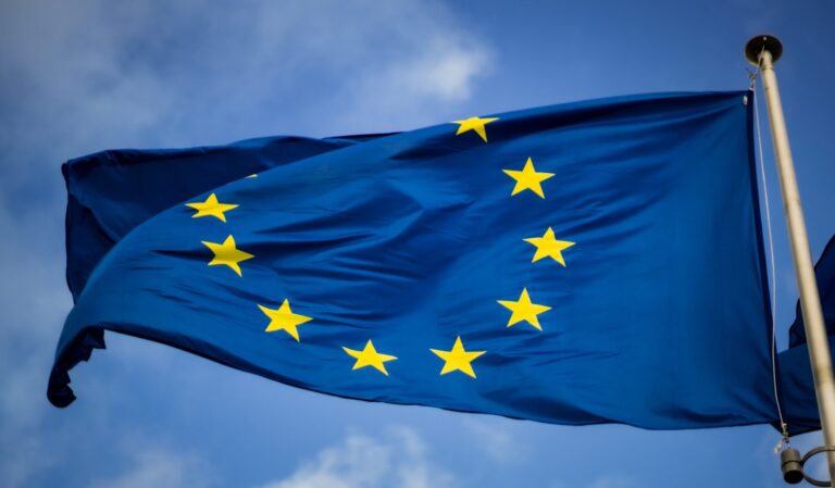 European Union flag against blue sky